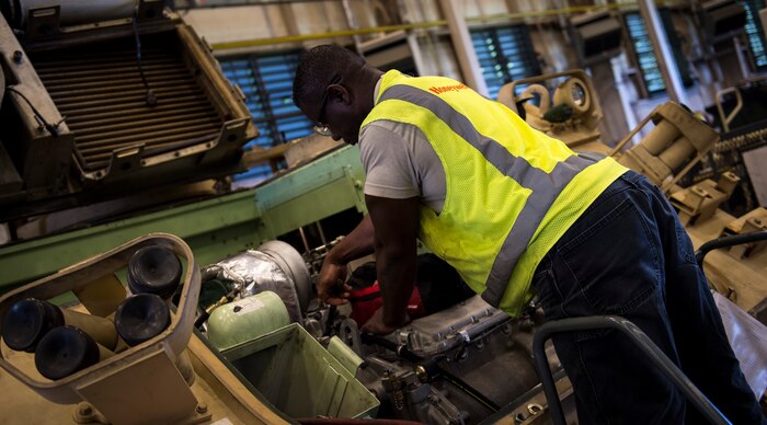 Anthony Moore, a mechanic with the Army Strategic Logistics Activity – Charleston, does maintenance on a M113 Armored Personnel Carrier Aug. 20, 2015 at Joint Base Charleston, S.C. ASLAC provides the U.S. warfighter the ability to quickly generate combat power at any location designated by the National Command Authority by establishing, maintaining and reconstituting Army Prepositioned Stocks Afloat. (U.S. Air Force photo/Airman 1st Class Clayton Cupit)