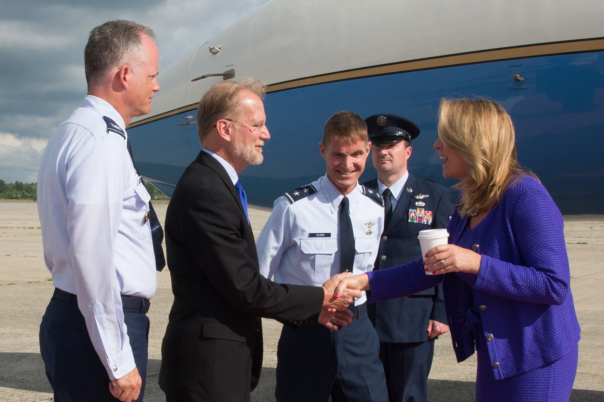 Secretary of the Air Force Deborah Lee James is welcomed to Hanscom Air Force Base, Mass., by Maj. Gen. Craig S. Olson, C3I and Networks program executive officer; Steve Wert, Battle Management PEO; and Col. Michael A. Vogel, 66th Air Base Group commander, on the base flightline Aug. 20. During her visit, James will receive briefings about Hanscom and its mission, view technology demonstrations, meet with the governor, members of the Mass. congressional delegation and other local leaders and have lunch with Airmen. (U.S. Air Force photo by Mark Herlihy)