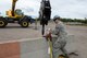 Staff Sgt. Austin Kemmer, of the 119th Civil Engineer Squadron, right, guides a rigging link onto a hook as Staff Sgt. Blake Robinson, of the 137th Civil Engineer Squadron, prepares to hoist a concrete barrier using a crane as they train at the North Dakota Air National Guard Regional Training Site, Fargo, North Dakota, August 19, 2015. The North Dakota Air National Guard Regional Training Site is one of five contingency training locations in the United States used by Air National Guard and U.S. Air Force personnel in the civil engineer career fields. I provides wartime mission training as well as proficiency training on construction practices, utility support, emergency services, maintenance and repair of base infrastructure. Four separate groups totaling about 400 people are scheduled to train at the site in the month of August in 2015. (U.S. Air National Guard photo by Senior Master Sgt. David H. Lipp/Released)
