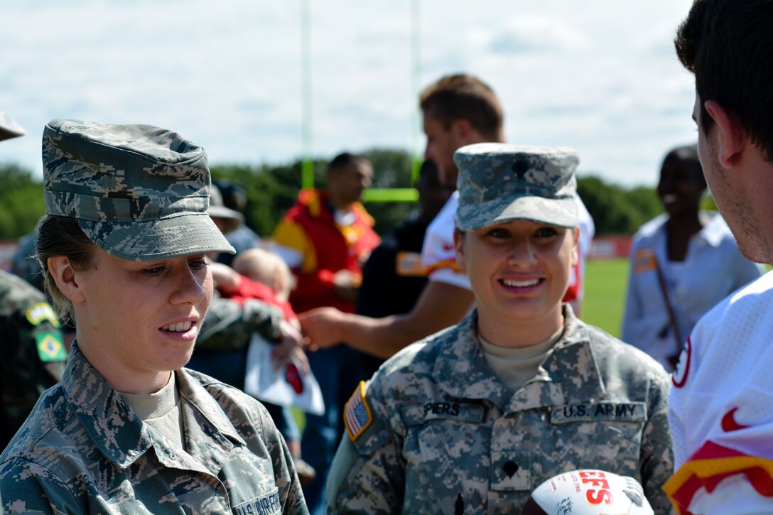 Airmen from the 139th Airlift Wing join other military service members as they attend the last day of the Kansas City Chiefs Training camp at Missouri Western University in St. Joseph, Mo., on Aug.19, 2015. The Chiefs invited military service members to be honored on their military appreciation day. (U.S. Air National Guard photo by Senior Airman Bruce Jenkins)