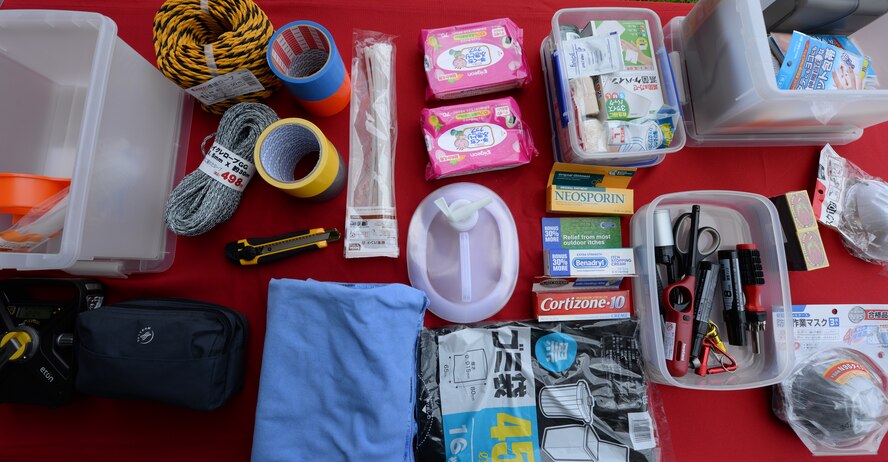 The contents of a typhoon kit are displayed on a table in front of the Exchange at the Typhoon Preparedness Extravaganza on Kadena Air Base, Japan, Aug. 15, 2015. The contents included the basic items to get through most natural disasters that may occur on Okinawa. The total amount spent to build a kit ranges from $70 to $150. (U.S. Air Force photo by Senior Airman Omari Bernard)
