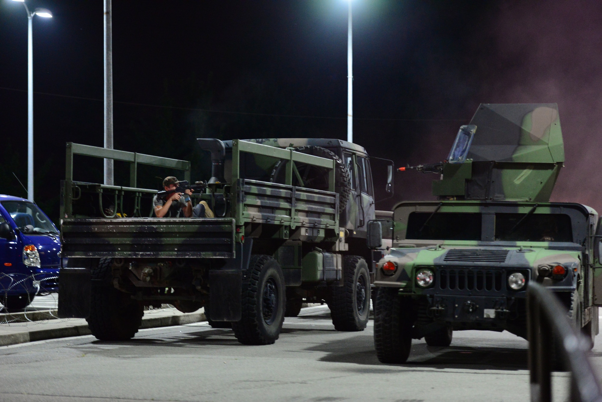 Airmen from the 51st Security Forces Squadron face off against simulated opposing forces in a battle for the base in exercise Beverly Midnight 15-03 at Osan Air Base, Republic of Korea, August 20, 2015. During this exercise, wing capabilities such as defending against simulated ground and aerial attacks and rapid-runway repair operations were tested. (U.S. Air Force photo/Staff Sgt. Amber Grimm)