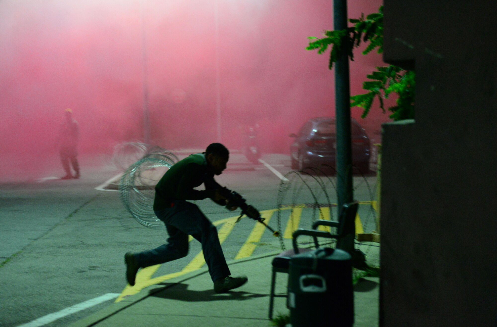 Opposing forces simulate an attack on a defensive fighting position manned by 51st Security Forces Squadron Airmen during exercise Beverly Midnight 15-03 at Osan Air Base, Republic of Korea, August 20, 2015. During this exercise, wing capabilities such as defending against simulated ground and aerial attacks and rapid-runway repair operations were tested. (U.S. Air Force photo/Staff Sgt. Amber Grimm)