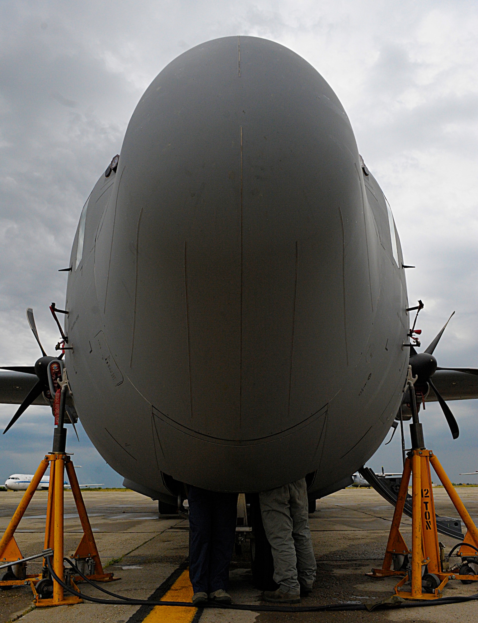 Airmen from the 86th Aircraft Maintenance Squadron and 86th Maintenance Squadron work on a C-130J Super Hercules assigned to the 37th Airlift Squadron, Ramstein Air Base, Germany, Aug. 17, 2015, at Otopeni Air Base, Romania. The aircraft’s nose landing gear steering control swivel valve broke and maintenance personnel were able to replace the part and get the aircraft back into action for Carpathian Summer, an off-station training exercise between the U.S. and Romanian air forces. Approximately 80 personnel traveled to Otopeni Air Base to participate in the bilateral training exercise. The U.S. Air Force transferred authority of three C-130Js participating in the exercise to NATO . This Transfer of Authority is a standard procedure that will serve to enhance interoperability and readiness to conduct combined air operations with Romania and NATO. The TOA will end at the conclusion of the exercise. (U.S. Air Force photo/Senior Airman Timothy Moore)