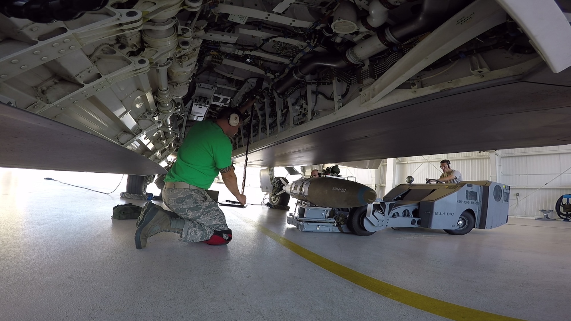 A GBU-32 Joint Direct Attack Munition is loaded onto an Alaska F-22 here Aug. 1. During the August Unit Training Assembly weekend Reserve pilots from the 302nd Fighter Squadron dropped JDAMs from F-22s equipped with increment 3.2A, a software upgrade package. (U.S. Air Force Photo/ Tech. Sgt. Dana Rosso)