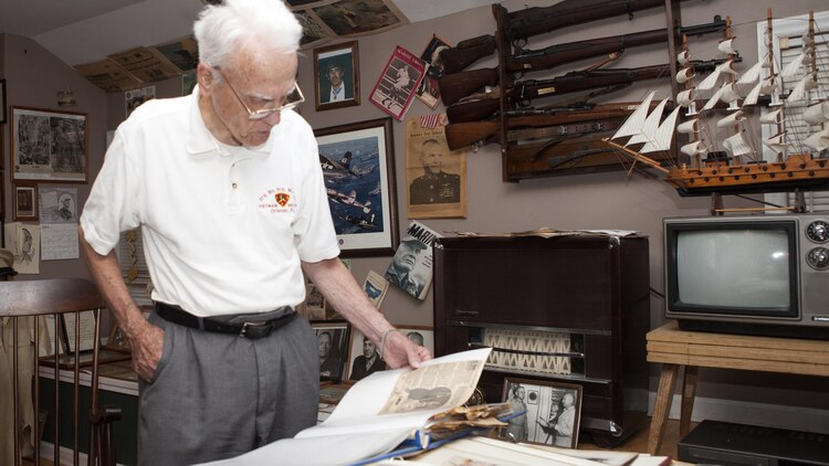 Arthur “Art” Orville Petty Jr., a Marine Vietnam veteran, looks at memorabilia in his Marine museum he created from a farm house on his property in Woodbury, Tenn., June 19, 2015. Petty enlisted into the Marine Corps March 13, 1941 and retired at the rank of sergeant major. 