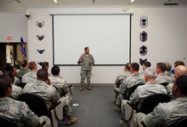 Col. Sean Farrell, 1st Special Operations Wing Commander, speaks with Airmen during a ribbon cutting ceremony at the Airmen Leadership School on Hurlburt Field, Fla., Aug. 17, 2015. The 823rd Red Horse Squadron and the 1st Special Operations Civil Engineering Squadron combined efforts to renovate an auditorium to meet increasing goals for student graduation sizes. (U.S. Air Force photo by Senior Airman Meagan Schutter/Released)