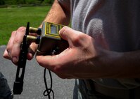 Airman 1st Class John Nipp, 1st Special Operations Civil Engineer explosive ordnance disposal apprentice, tests the continuity of blasting caps with an Ohmmeter before an explosive demonstration on Hurlburt Field, Fla., Aug. 5, 2015. The EOD Airmen held a live demonstration for chaplain candidates to showcase the effects of explosives and strengthen ties between both career fields. (U.S. Air Force photo/Senior Airman Meagan Schutter)