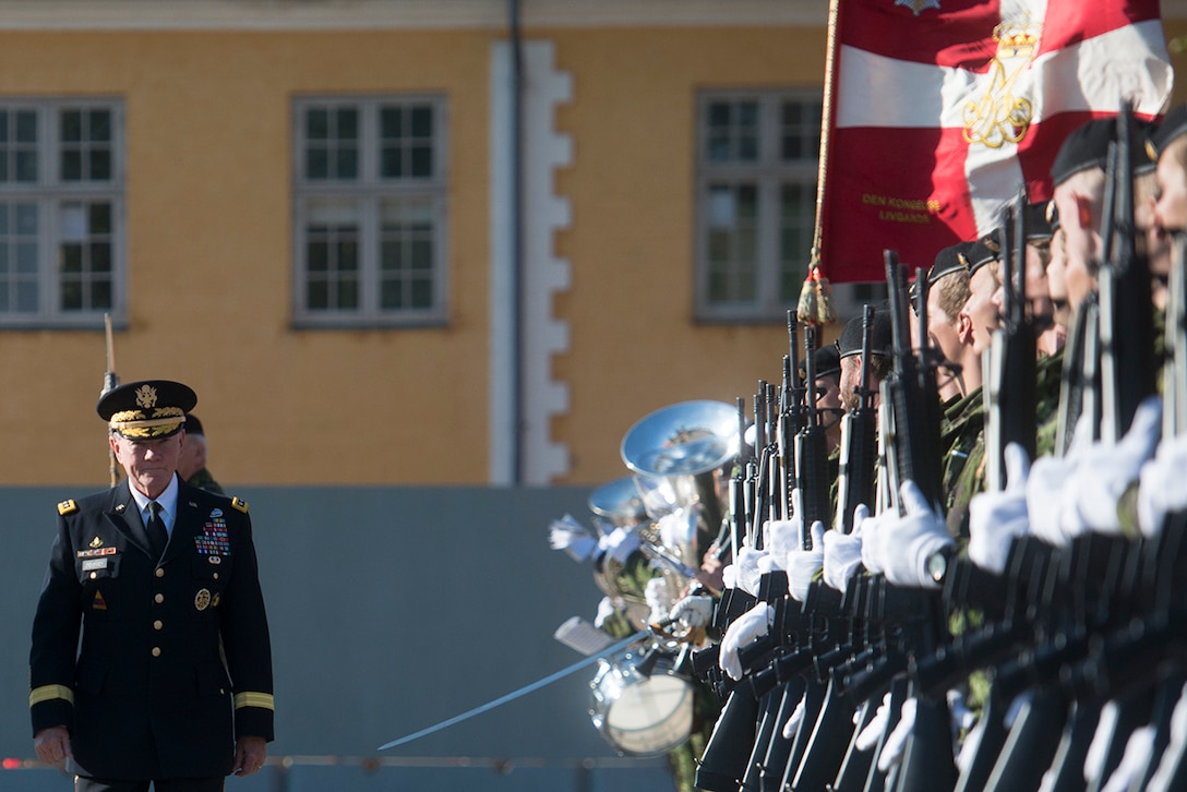 U.S. Army Gen. Martin E. Dempsey, chairman of the Joint Chiefs of Staff, participates in a pass-and-review ceremony with a Danish honor guard at the Citadel in Copenhagen, Denmark, Aug. 18, 2015. Danish King Christian 4 founded the Citadel, now used as military barracks and offices, in 1626. DoD photo by D. Myles Cullen