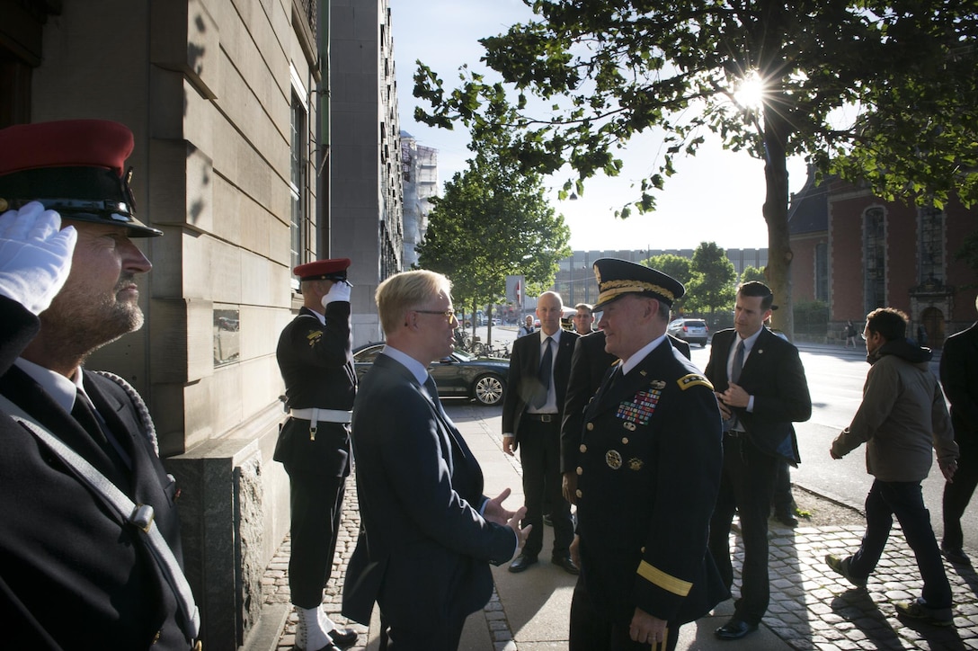 Danish Defense Minister Carl Holst greets U.S. Army Gen. Martin E. Dempsey, chairman of the Joint Chiefs of Staff, at the Danish Defense Ministry in Copenhagen, Denmark, Aug. 18, 2015. DoD photo by D. Myles Cullen