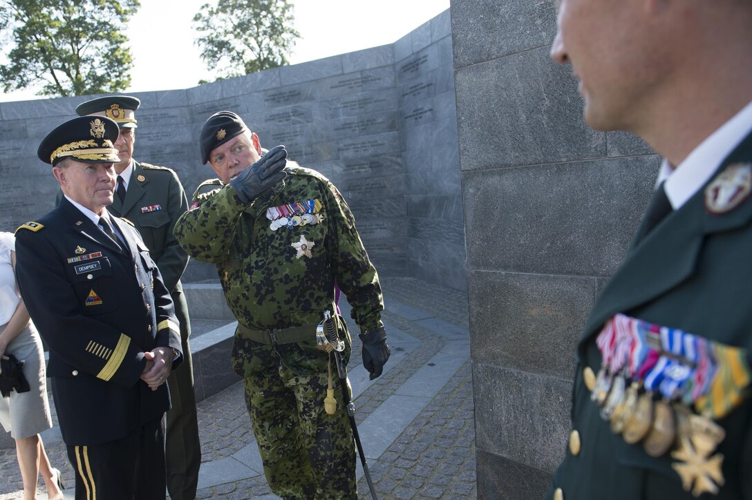 U.S. Army Gen. Martin E. Dempsey, chairman of the Joint Chiefs of Staff, receives a tour of the Danish veterans memorial at the Citadel in Copenhagen, Denmark, Aug. 18, 2015. DoD photo by D. Myles Cullen