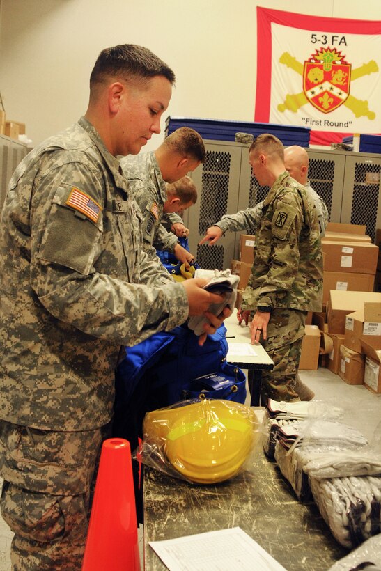 Soldiers receive personnel protective equipment as they prepare to serve as firefighters to assist the National Interagency Fire Center on Joint Base Lewis-McChord, Wash., Aug. 19, 2015. U.S. Army photo by Sgt. Quanesha Deloach