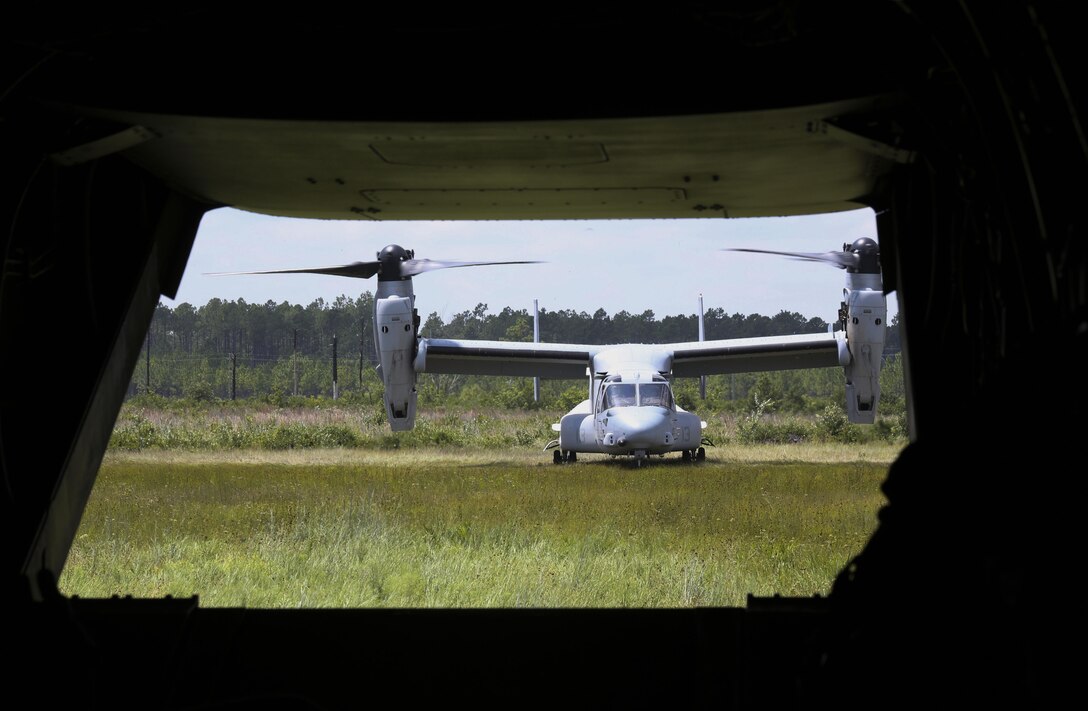 Two MV-22 Osprey piloted by Marines with Marine Medium Tiltrotor Squadron 264, land at Landing Zone Kingfisher, Camp Lejeune, N.C., Aug. 12, 2015. Upon completion of troop transport, air crews practiced tactical landings, utilizing the Osprey’s unique blend of helicopter and fixed-wing aircraft, to complete their operation. (U.S. Marine Corps photo by Cpl. Paul S. Martinez/Released)
