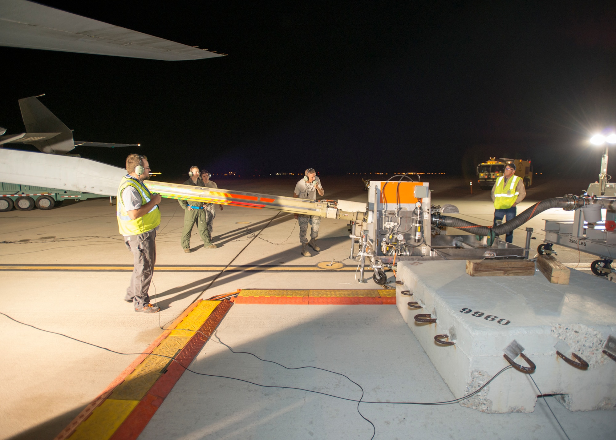 Travis AFB, California, maintainers observe the KC-10 boom making contact with Boeing's boom test unit. (U.S. Air Force photo by Brad White)
