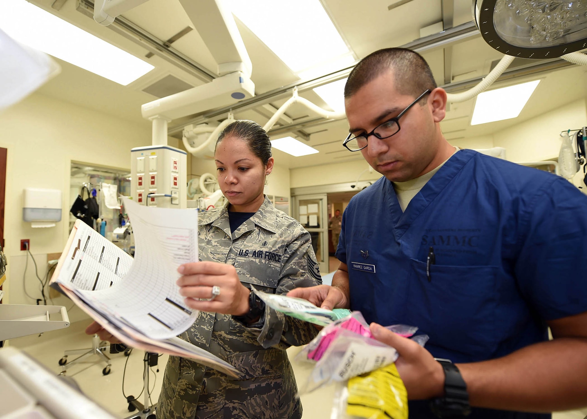 Tech. Sgt. Latoya Carson and Senior Airman Ernesto Ramirez Garcia, medical technicians from the 959th Medical Group, take inventory of supplies in the emergency room at the San Antonio Military Medical Center, Joint Base San Antonio-Fort Sam Houston, Aug. 7, 2015. The 959th MDG works with Army counterparts at SAMMC to staff the only Level 1 trauma center in the Department of Defense. (U.S. Air Force photo by Staff Sgt. Jerilyn Quintanilla) 