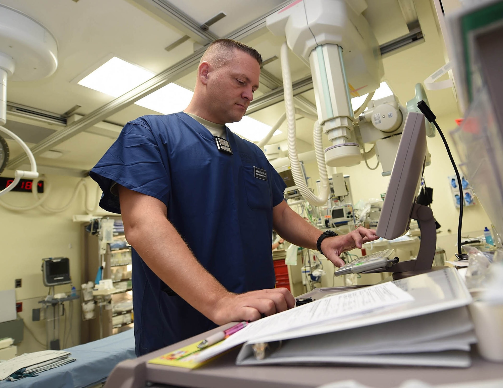 Capt. Edgar Miller, a nurse from the 959th Medical Group, logs into a Pyxis MedStation system in the emergency room at the San Antonio Military Medical Center, Joint Base San Antonio-Fort Sam Houston, Aug. 7, 2015. Airmen with the 959th MDG play a significant role in all facets of trauma care at SAMMC. (U.S. Air Force photo by Staff Sgt. Jerilyn Quintanilla)