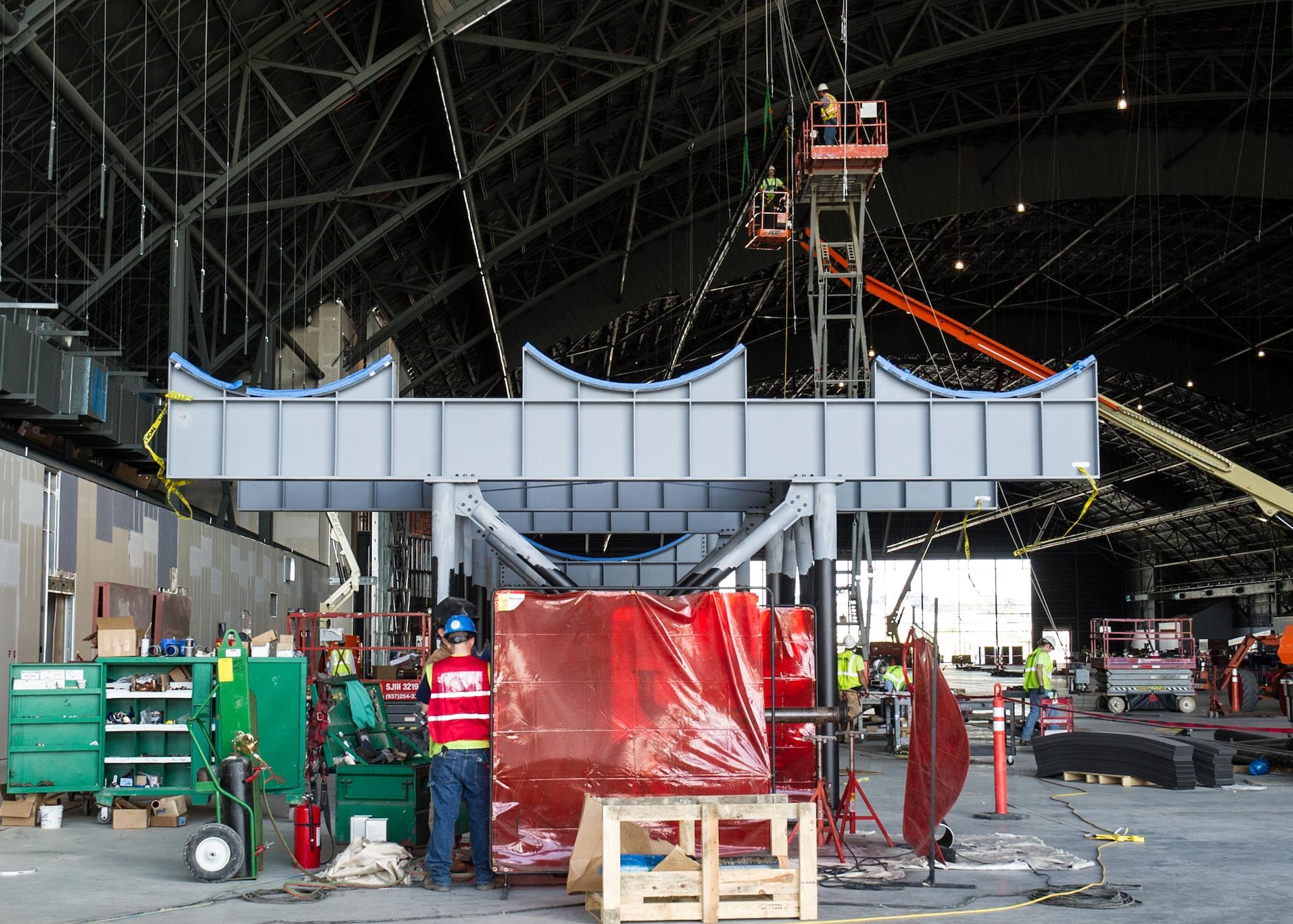 DAYTON, Ohio – Construction crew members working on the stand for the Titan 4B Space Launch Vehicle on August 20, 2015, in Dayton, Ohio. The 224,000 square foot building, which is scheduled to open to the public in 2016, is being privately financed by the Air Force Museum Foundation, a non-profit organization chartered to assist in the development and expansion of the museum's facilities. (U.S. Air Force photo)