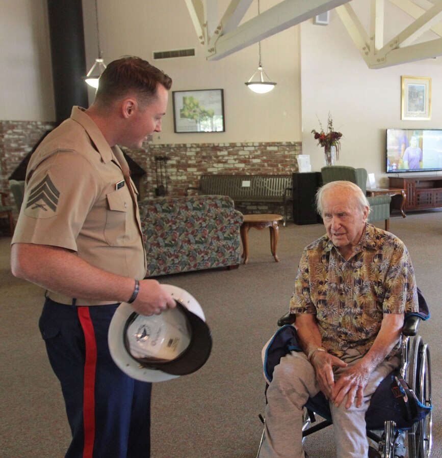 SACRAMENTO – A 100-year-old Marine, Michael Kolesar, meets with Sgt. Robert S. Powers, recruiter, Marine Recruiting Station Sacramento, at the Eskaton Care Center in Greenhaven, Aug. 21. Marines met with Michael to take photos as part of the care center’s efforts to recognize centenarians. Michael fought during the famous battle of Guadalcanal. He later played professional baseball for the Browns and served as a deputy sheriff. (U.S. Marine Corps photo by Staff Sgt. Jacob Harrer / released)