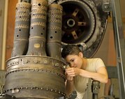 Airman 1st Class Rosemary Dimola, 361st Training Squadron student, installs and inspects thermocouples during a T-56 engine build up used on a C-130 Hercules aircraft Aug. 12, 2015, at Sheppard Air Force Base, Texas. The Thermocouples reads the inlet temperature inside the engine and is necessary for letting the pilot know the temperature of the turbine engine. (U.S. Air Force photo by Danny Webb)