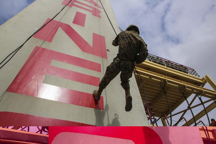 A recruit of Alpha Company, 1st Recruit Training Battalion, descends the rappel tower at Marine Corps Recruit Depot San Diego, Calif., Aug. 21. The tower instills confidence in the recruits by having them face their fears and successfully conquer the 60-foot structure. The depot is responsible for training more than 16,000 recruits annually and Alpha Company will graduate recruit training Sept. 4. 