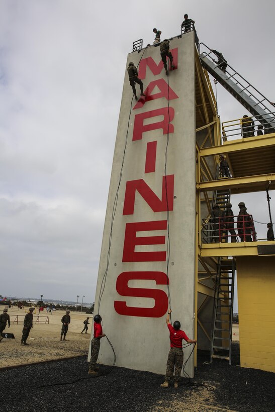 Recruits of Alpha Company, 1st Recruit Training Battalion, descend the rappel tower at Marine Corps Recruit Depot San Diego, Calif., Aug. 21. The tower instills confidence in the recruits by having them face their fears and successfully conquer the 60-foot structure. The depot is responsible for training more than 16,000 recruits annually and Alpha Company will graduate recruit training Sept. 4. 