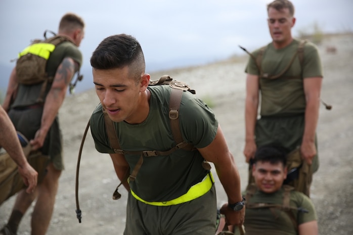 Marines assigned to Headquarters and Service Company, 3rd Battalion, 5th Marine Regiment, 1st Marine Division, carry a simulated casualty as part of the Dark Horse Ajax Challenge aboard Marine Corps Base Camp Pendleton, Calif., Aug. 20, 2015. The eight-mile course tested the Marines’ and Sailors’ endurance and leadership skills with trials spread across the San Mateo area. (U.S. Marine Corps photo by Cpl. Will Perkins)