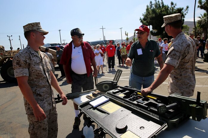 Marines with 3rd Battalion, 5th Marine Regiment, 1st Marine Division show Vietnam veterans, that are members of the 1st Mar. Div. Association, equipment used by the marine Corps today during the 68th annual reunion, aboard Marine Corps base Camp Pendleton, Calif., Aug. 20, 2015. During the reunion, veterans visited their old stomping grounds and reminisced about their days serving in the division, while also observing the capabilities of today’s Marines. (U.S. Marine Corps photo by Cpl. Demetrius Morgan/RELEASED)