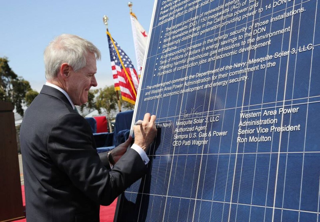 NAVAL AIR STATION NORTH ISLAND, Calif. -- The Honorable Secretary of the Navy Ray Mabus hosts a signing ceremony with the Western Area Power Administration and Sempra U.S. Gas & Power at Naval Base Coronado, Aug. 20. The ceremony marked the signing of the largest renewable energy purchase by a federal entity. Patti Wagner, chief executive officer, Sempra U.S. Gas & Power, and Ron Moulton, senior vice president, Western Area Power, acted as representatives of their respective entities.

Distinguished guests were invited to sign a solar panel in honor of the agreement. Brig. Gen. Edward D. Banta, Commanding General, Marine Corps Installations West Marine Corps Base Camp Pendleton, added his signature to the panel.

(Photo by Cpl. Asia J. Sorenson/Released)