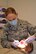 Lt. Col. Angela McDonough, 111th Attack Wing dental clinic officer-in-charge, provides a dental exam in the medical facility April 24, 2015, at Horsham Air Guard Station, Pennsylvania. The dental staff now has walk-in hours available during the week for in-status Guardsmen. (U.S. Air National Guard photo by Tech. Sgt. Andria Allmond/Released)