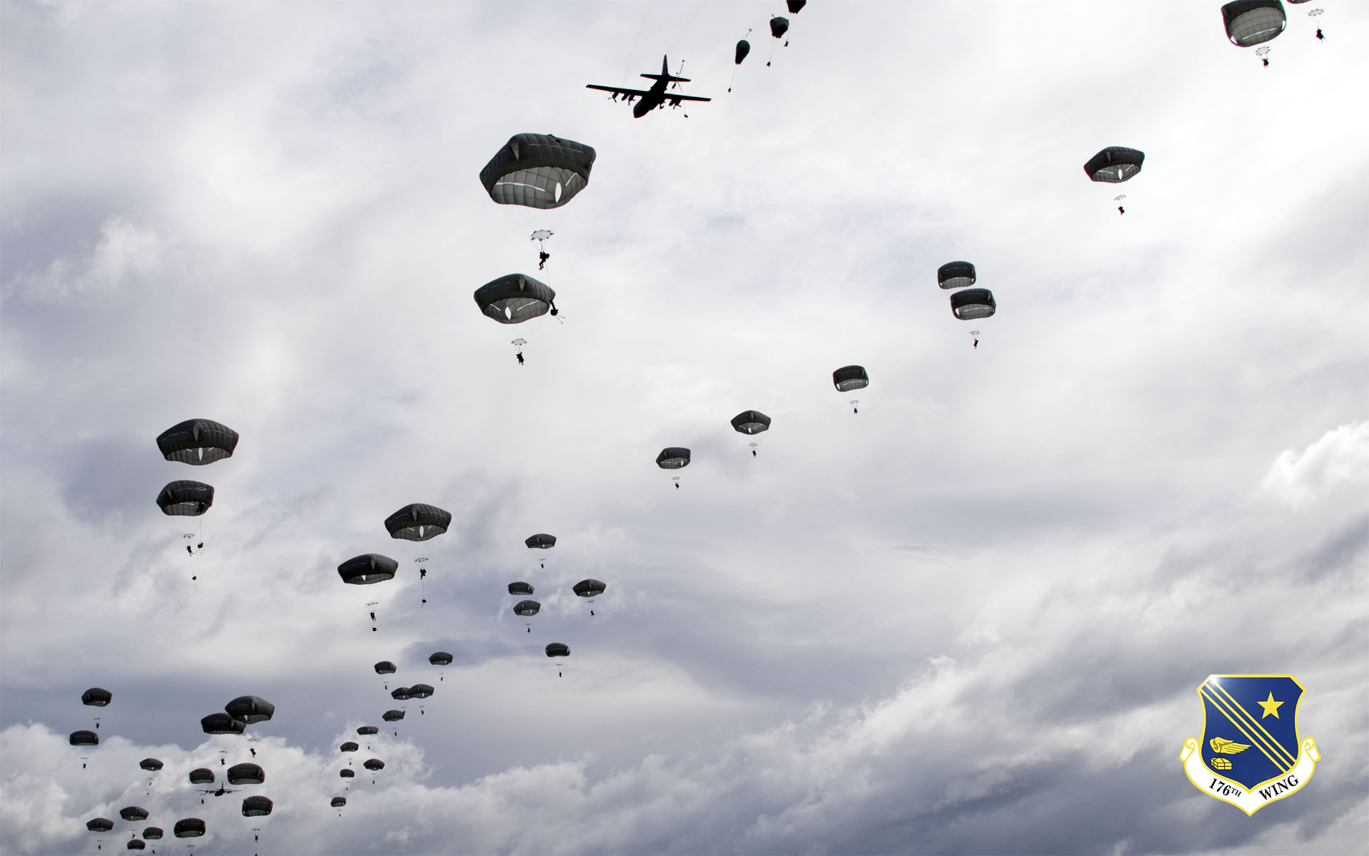 C-130s from the Alaska Air National Guard's 144th Airlift Squadron drop Army paratroopers over the Malemute Drop Zone June 7, 2014. National Guard photo by Capt. John Callahan.