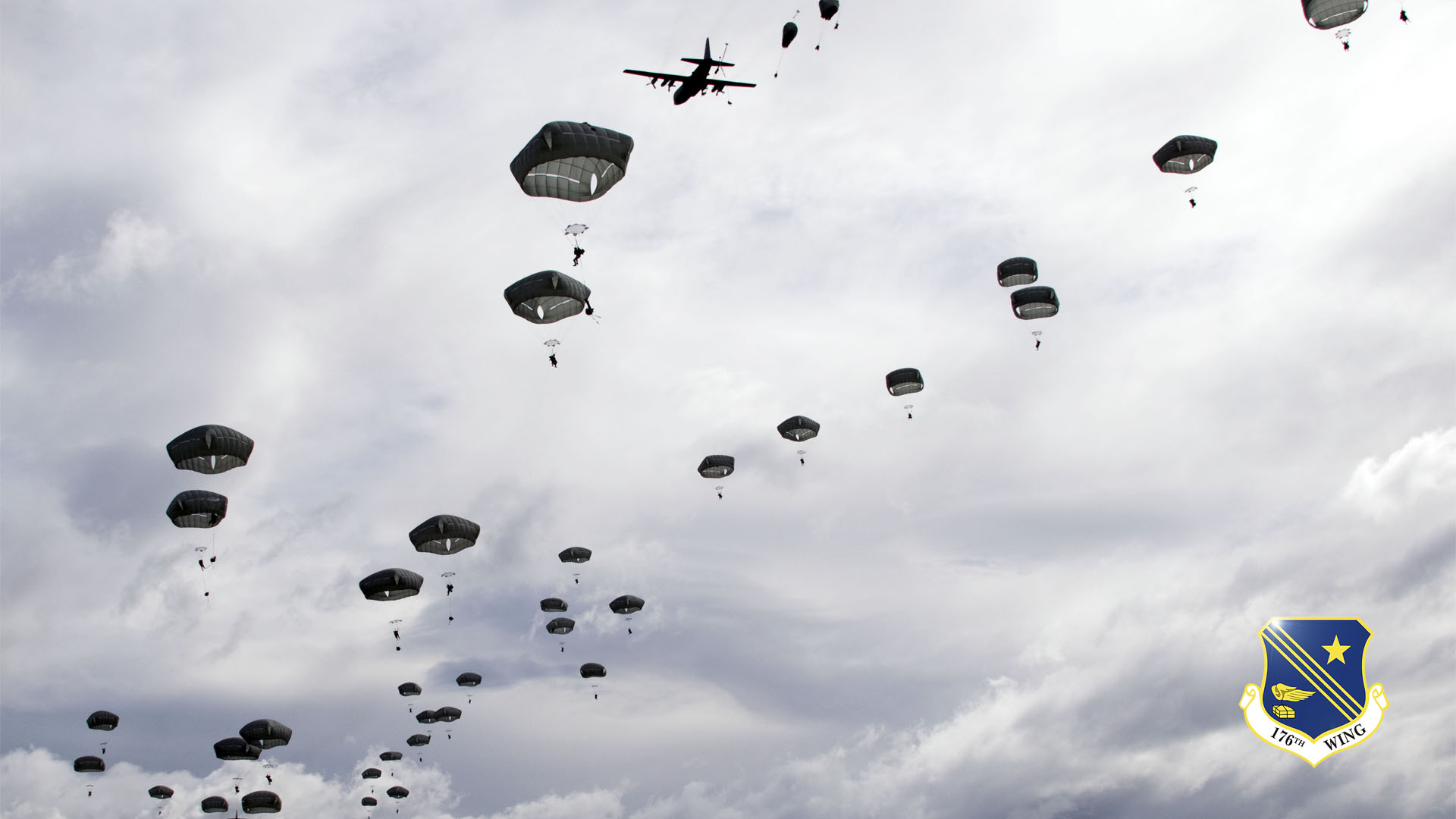C-130s from the Alaska Air National Guard's 144th Airlift Squadron drop Army paratroopers over the Malemute Drop Zone June 7, 2014. National Guard photo by Capt. John Callahan.