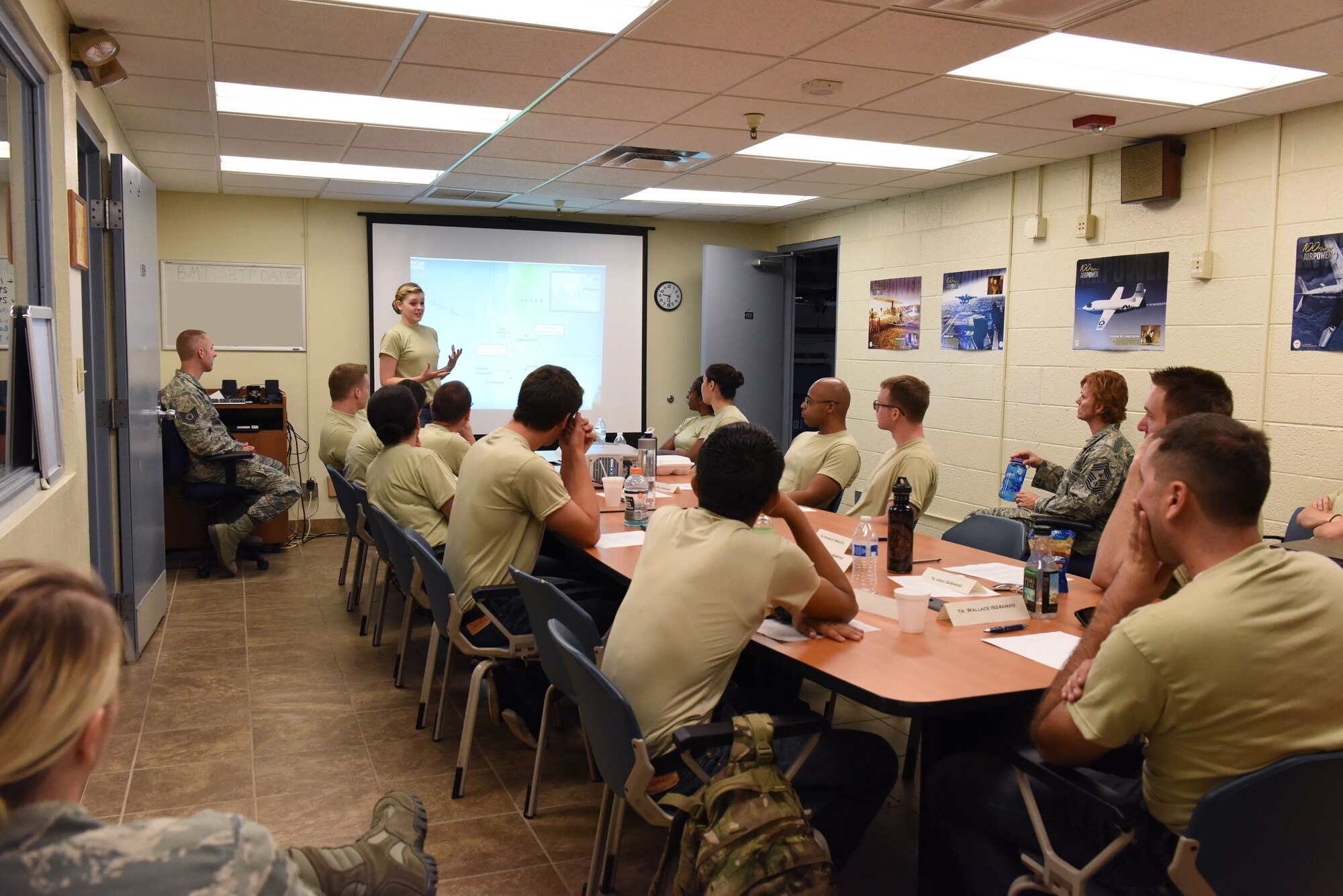 Page Dixon, Development Training Flight trainee, briefs on the Bataan Death March during the August Training Assembly, Aug. 9, 2015. The trainees were tasked to choose a subject about Air Force history to report. The DTF was created by the Air Force Reserve in 2011 to help civilians transition into military life, manage expectations and increase their success during basic military training and their Air Force career.  Before members go to basic training they are introduced to Air Force customs and courtesies, drill and ceremony, dress and appearance, fitness requirements and military life in general. (U.S. Air Force photo by Staff Sgt. Lausanne Kinder)