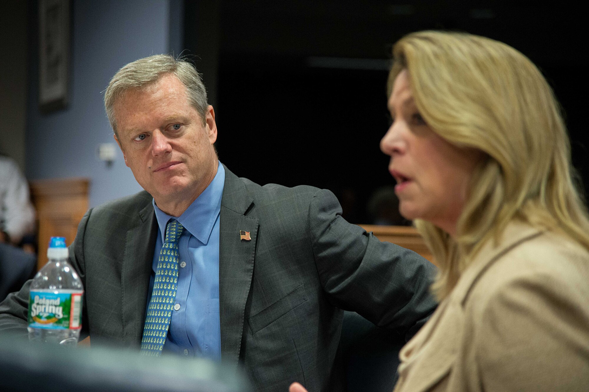 Mass. Governor Charlie Baker listens as Secretary of the Air Force Deborah Lee James speaks during a Massachusetts-Hanscom Collaboration Forum at Hanscom Air Force Base, Mass., Aug 21. Baker, along with six members of the Mass. Congressional delegation, expressed their strong support for Hanscom AFB and extolled the benefits of a regional intellectual 'ecosystem' composed of industry, academia, technical consortia and federally funded research and development centers MITRE and MIT -Lincoln Laboratory. (U.S. Air Force photo by Mark Herlihy)