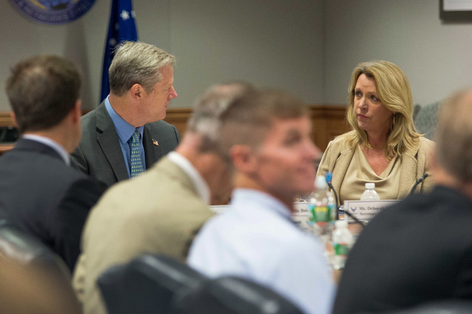 Mass. Governor Charlie Baker and Secretary of the Air Force Deborah Lee James talk during a Massachusetts-Hanscom Collaboration Forum at Hanscom Air Force Base, Mass., Aug 21. Baker, along with six members of the Mass. Congressional delegation, expressed their strong support for Hanscom AFB and extolled the benefits of a regional intellectual 'ecosystem' composed of industry, academia, technical consortia and federally funded research and development centers MITRE and MIT -Lincoln Laboratory. (U.S. Air Force photo by Mark Herlihy)