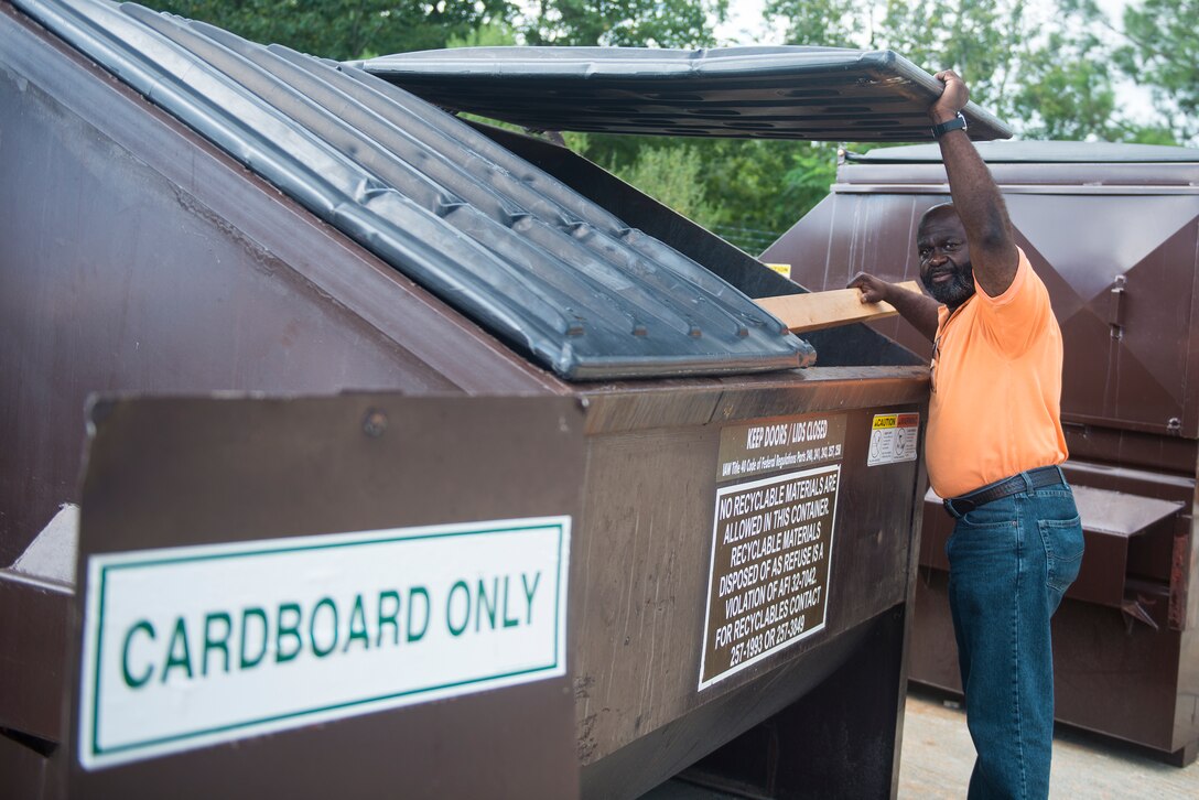 Elvis Lane, 23d Civil Engineer Squadron pollution prevention manager, sorts through the dumpster at the recycling center Aug. 20, 2015, at Moody Air Force Base, Ga. Moody’s recycling program  educates Airmen on the importance of reducing, reusing and recycling. (U.S. Air Force photo by Airman 1st Class Ceaira Tinsley/Released)