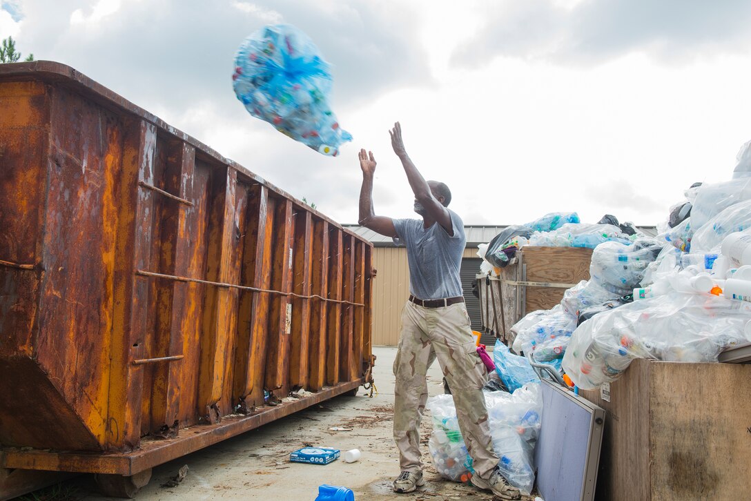James Clemons, recycling center operator, loads a dumpster at the recycling center Aug. 20, 2015, at Moody Air Force Base, Ga. The recycling center sorts through and recycles more than 60 tons of garbage monthly. (U.S. Air Force photo by Airman 1st Class Ceaira Tinsley/Released)