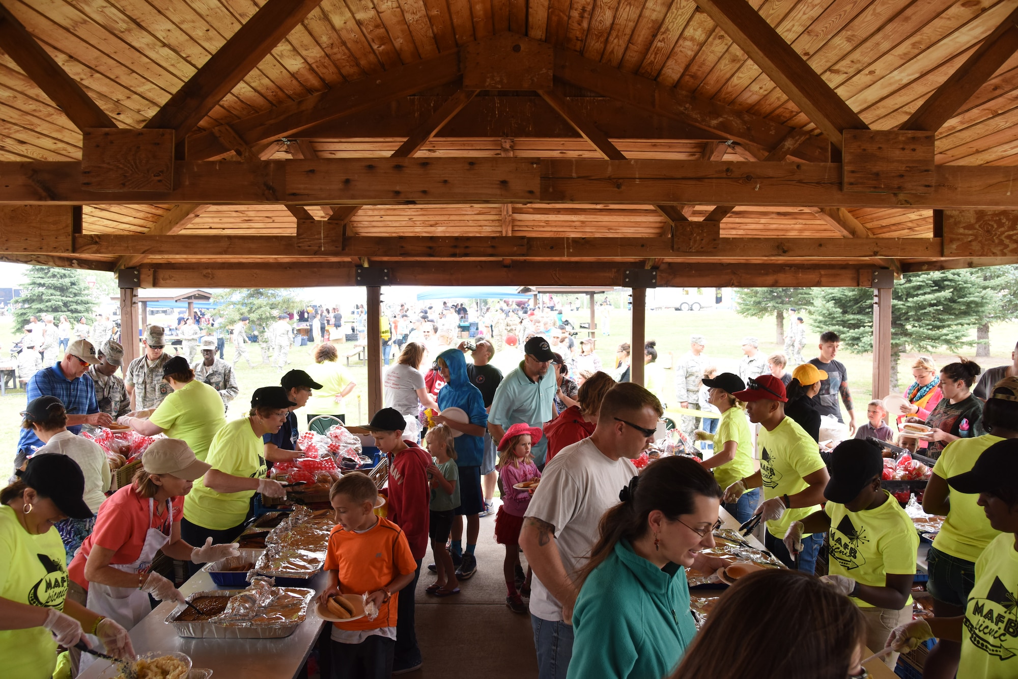 Team Malmstrom members get together during the annual base picnic at Sun Plaza Park at Malmstrom Air Force Base Aug 21. Members of the Military Affairs Committee volunteered alongside Team Malmstrom members to cook food, serve food and operate stations for children’s activities. (U.S. Air Force Photo/Airman 1st Class Collin Schmidt) 