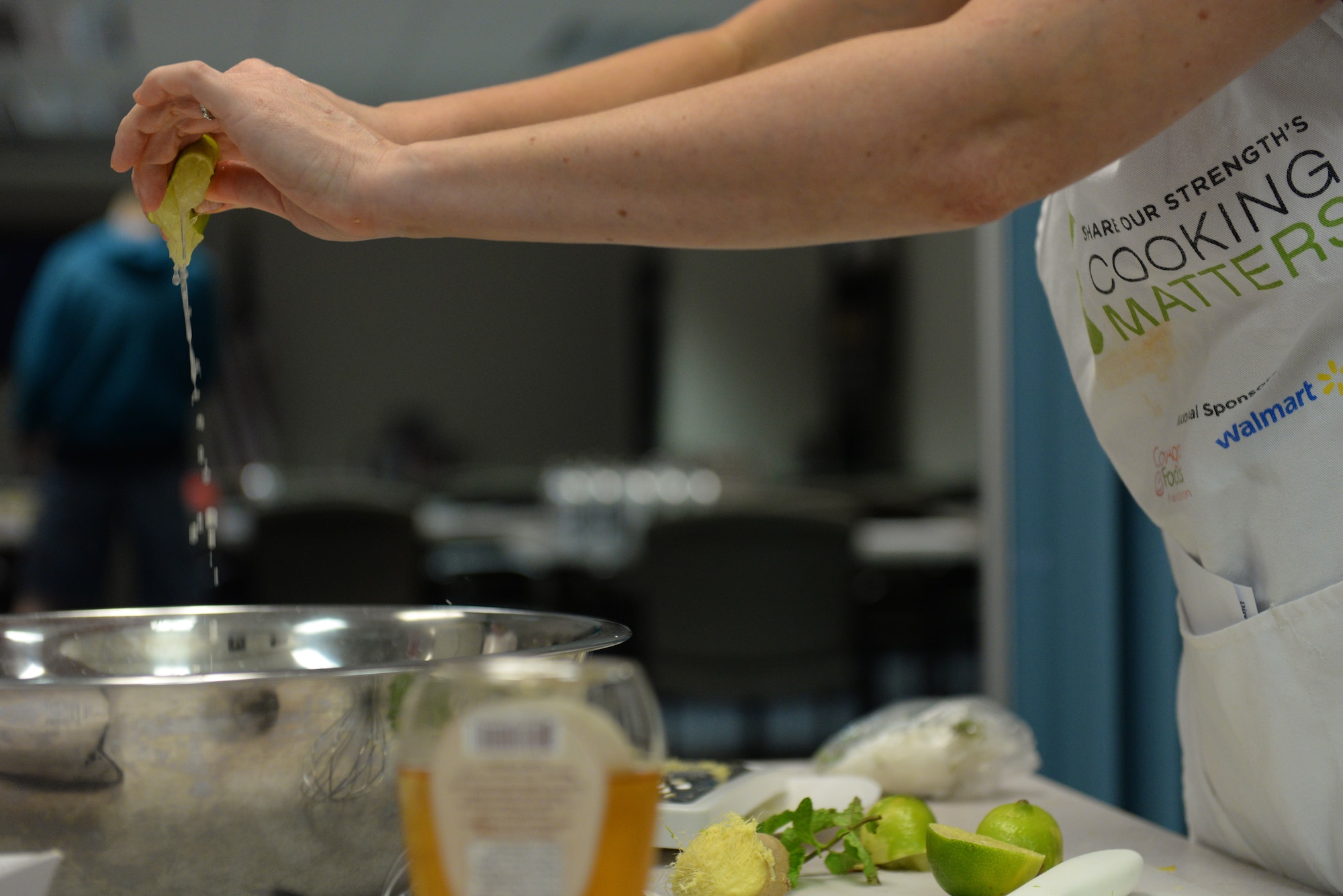 Melissa Mobley, Cooking Class Instructor with Operation Food Search, combines ingredients for a cantaloupe salad during the EMFP Garden to Table Cooking Class, August 6, 2015, Scott Air Force Base, Illinois. Mobley taught the class, which was focused on using fresh produce and incorporating it into meals, using the examples of quesadillas, different salsas and a cantaloupe salad. (U.S. Air Force photo by Airman 1st Class Erica Holbert-Siebert)