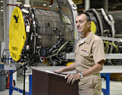 Rear Adm. Randolph L. Mahr, deputy executive officer of the F-35 Joint Strike Fighter program, thanks members of the 76th Propulsion Maintenance Group’s F135 engine line for their hard work and dedication to completing maintenance modifications to the engine on target. The F135 engine powers the F-35 Lightning II, and in an announcement made on July 31 by the Marine Corps, operating capabilities began for the Marine Fighter Attack Squadron 121 in Yuma, Ariz. (Air Force photo by Kelly White/Released)


