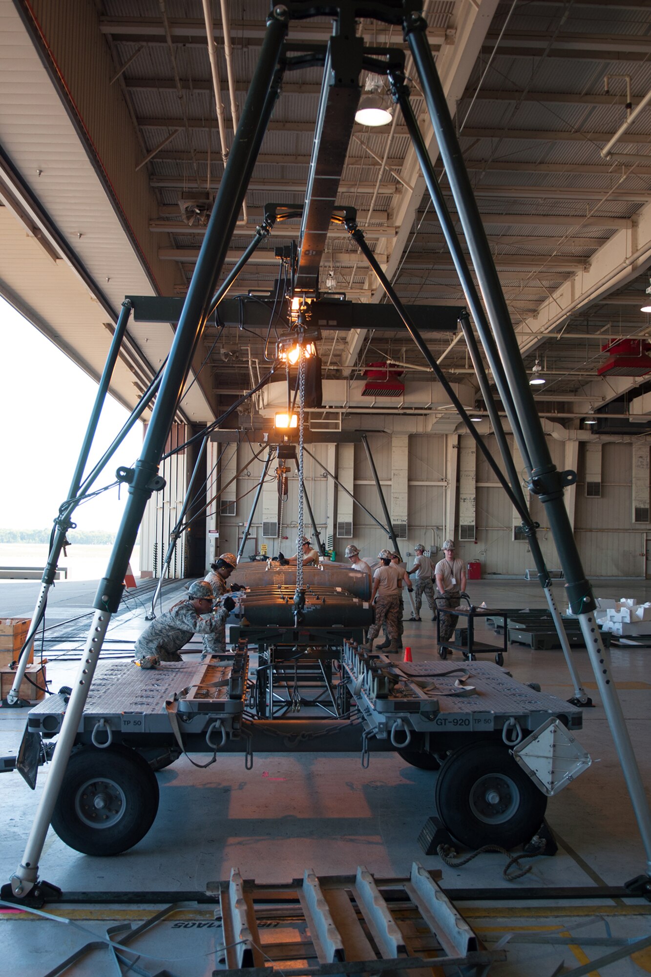 Eleven U.S. Air Force Airmen from the Munitions Flight of the 307th Maintenance Squadron compete for the Ellis Giant Sword Trophy of the Global Strike Challenge on Aug. 14, 2015 on Barksdale Air Force base. The team is competing against other units in the Air Force Global Strike Command by showing their swiftness and accuracy assembling a Munitions Assembly Conveyor, a conventional munitions bomb build and vehicle challenges. (U.S. Air Force photo by Master Sgt. Dachelle Melville/Released)