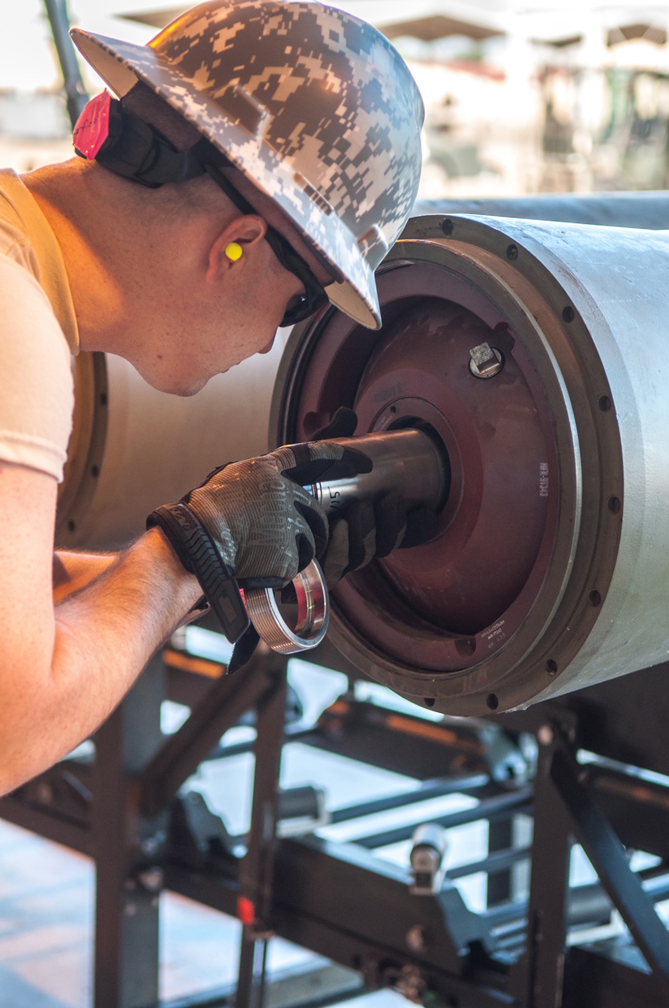 U.S. Air Force Senior Airman Andrew Barfield, a Munitions System Journeyman assigned to the 307th Maintenance Squadron, inserts a fuse into the back on an inert BLU-109 bomb body during the bomb building portion of the Global Strike Challenge on Barksdale Air Force Base, La. on Aug. 14, 2015. Barfield is one of 11 team members that are competing in the munitions maintenance portion for the Ellis Giant Sword Trophy which is awarded to the best conventional maintenance team in Air Force Global Strike Command. (U.S. Air Force photo by Master Sgt. Dachelle Melville/Released)
