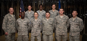 Col. Robert Lyman, Joint Base Charleston commander (left) and Chief Master Sgt. Mark Bronson, 628th Air Base Wing command chief (right), stand with Staff Sgt. selects from the 628th ABW Aug. 20, 2015, at the Charleston Club on Joint Base Charleston, S.C. The purpose of the event was to highlight the achievement, acknowledge the selectees and give them an opportunity to celebrate and socialize with other selectees, friends and family. (U.S. Air Force photo/Airman 1st Class Clayton Cupit)