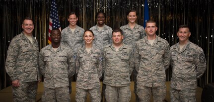 Col. Robert Lyman, Joint Base Charleston commander (left) and Chief Master Sgt. Mark Bronson, 628th Air Base Wing command chief (right), stand with Staff Sgt. selects from the 628th ABW Aug. 20, 2015, at the Charleston Club on Joint Base Charleston, S.C. The purpose of the event was to highlight the achievement, acknowledge the selectees and give them an opportunity to celebrate and socialize with other selectees, friends and family. (U.S. Air Force photo/Airman 1st Class Clayton Cupit)