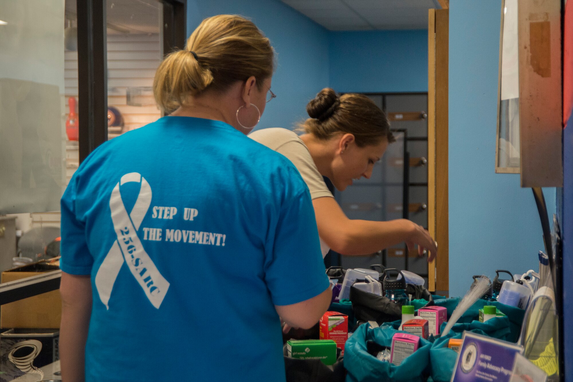 An Airman looks at the prizes while learning about sexual assault during the Sexual Assault Prevention and Response "Back to School Bowl-a-thon" at  Stars and Strikes Bowling Center,  August 13, 2015, at Scott Air Force Base, Ill. The goal of the event was to provide important sexual assault information in a stress free environment. (U.S. Air Force photo by Airman 1st Class Melissa Estevez)