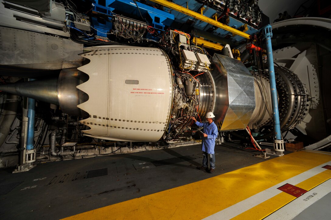 Performance testing on the Rolls-Royce Trent 1000-TEN engine was recently completed in the Aeropropulsion Systems Test Facility (ASTF) C-2 engine test cell at AEDC. Pictured is Eric Brumley, ATA outside machinist, inspecting the engine prior to the test. (Photo by Rick Goodfriend)