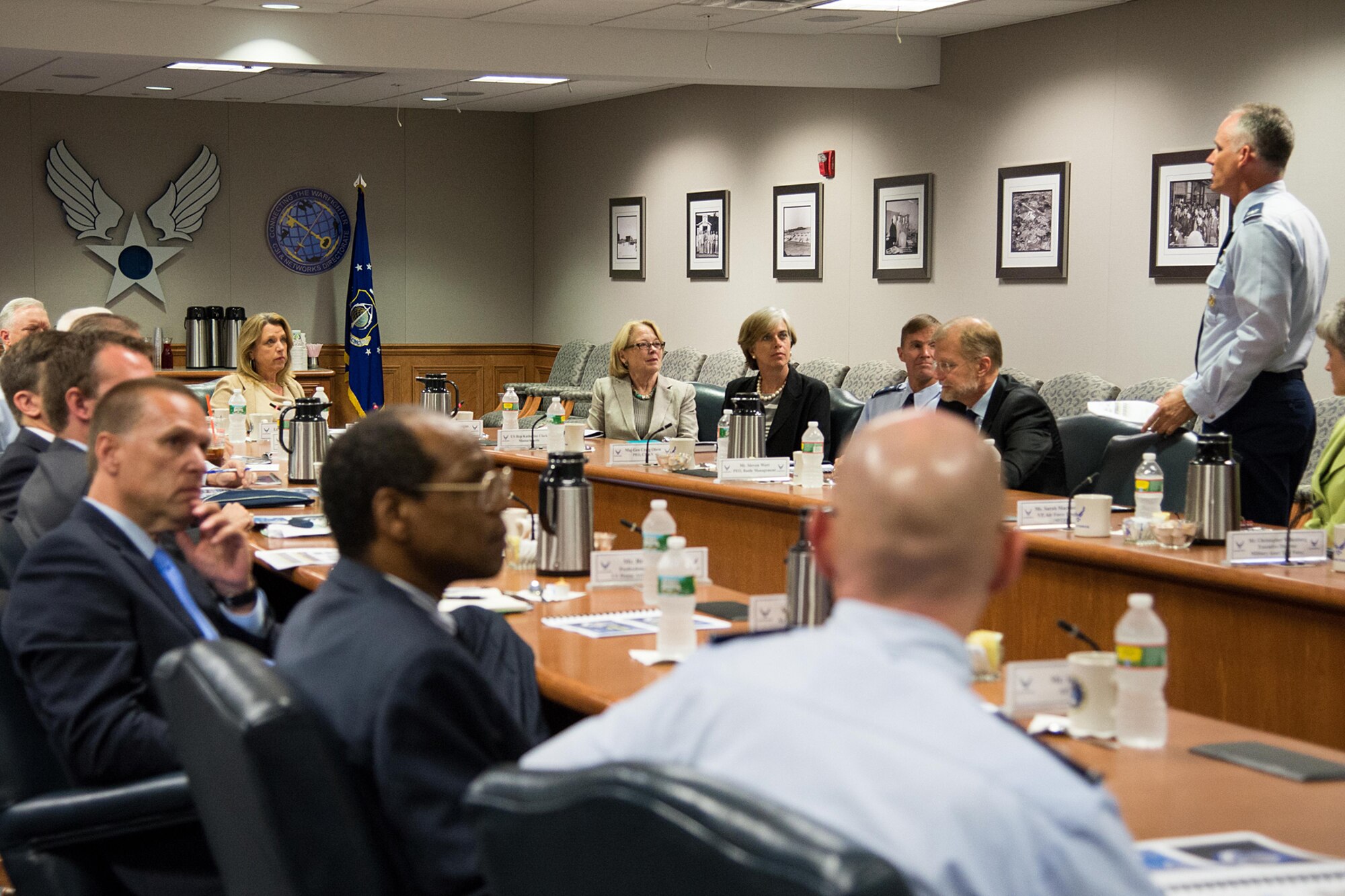 Col. Michael A. Vogel, 66th Air Base Group commander, briefs Secretary of the Air Force Deborah Lee James, left, U.S. Rep. Niki Tsongas, center, U.S. Rep. Katherine Clark and others during a mission overview in Building 1606 Aug. 21. James and members of the Mass. congressional delegation participated in the briefing. (U.S. Air Force photo by Mark Herlihy) 