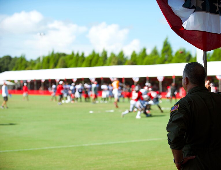 Military members from MacDill Air Force Base showed up in force to cheer on their hometown team, the Tampa Bay Buccaneers. Closed to the general public, the Bucs opened their gates and completed their final day of training camp with a Salute to the Military. (U.S. Air Force Photo/Tech. Sgt. Peter Dean)