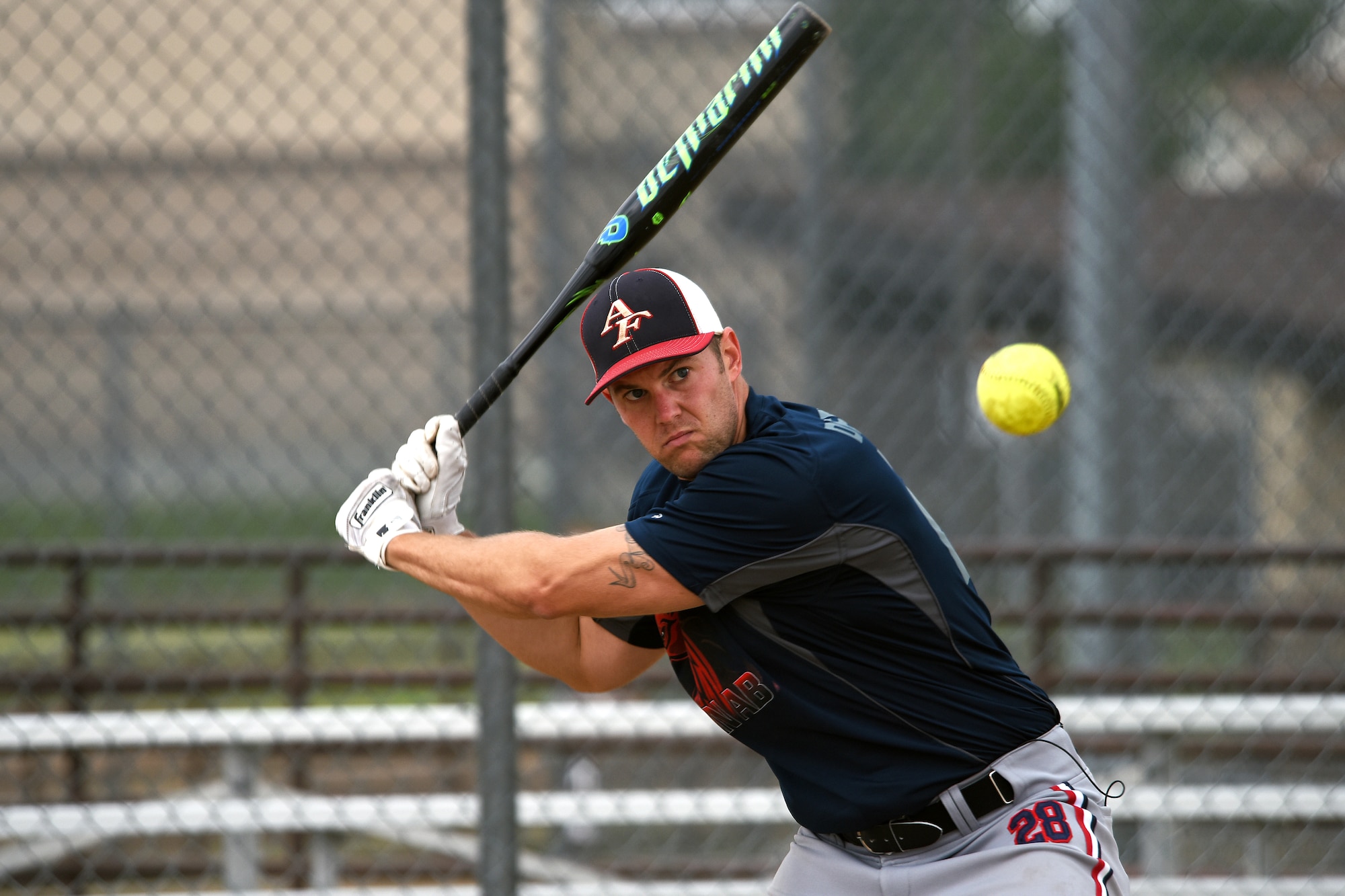 Staff Sgt. Jimmy Fulcher, 341st Security Forces Group evaluator, practices on the baseball field Aug. 17, 2015, at Malmstrom Air Force Base, Mont. Fulcher has been training to try out for the Air Force men's softball team.  (U.S. Air Force photo/Chris Willis) 