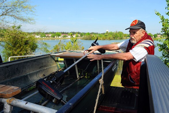 Ernest Cooling packs his boat after a morning of fishing at Scout Lake. The 22-acre site offers beautiful scenery and a play to relax and try your hand at fishing. (U.S. Air Force photo by Tommie Horton)