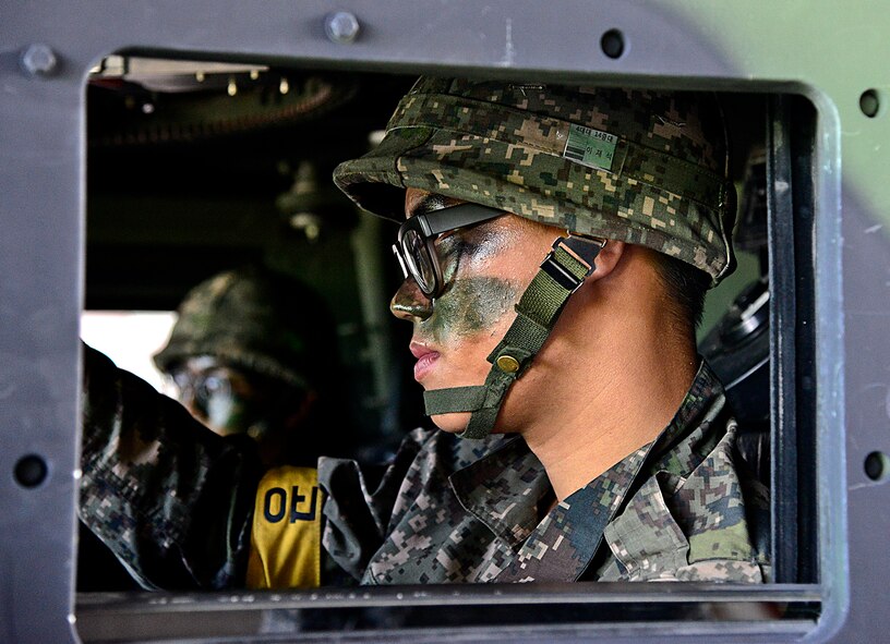 Defenders from the 51st Security Forces Squadron and Republic of Korea army soldiers from the 4th Battalion 169th Regiment, set out for a training area outside Osan Air Base, ROK, Aug. 19, 2015. The Airmen and ROK soldiers practiced joint missions during the readiness exercise Beverly Midnight 15-03. The joint exercise helped prepare Airmen and soldiers through various combat strategies in the event of enemy attack. (U.S. Air Force photo/Senior Airman Kristin High)